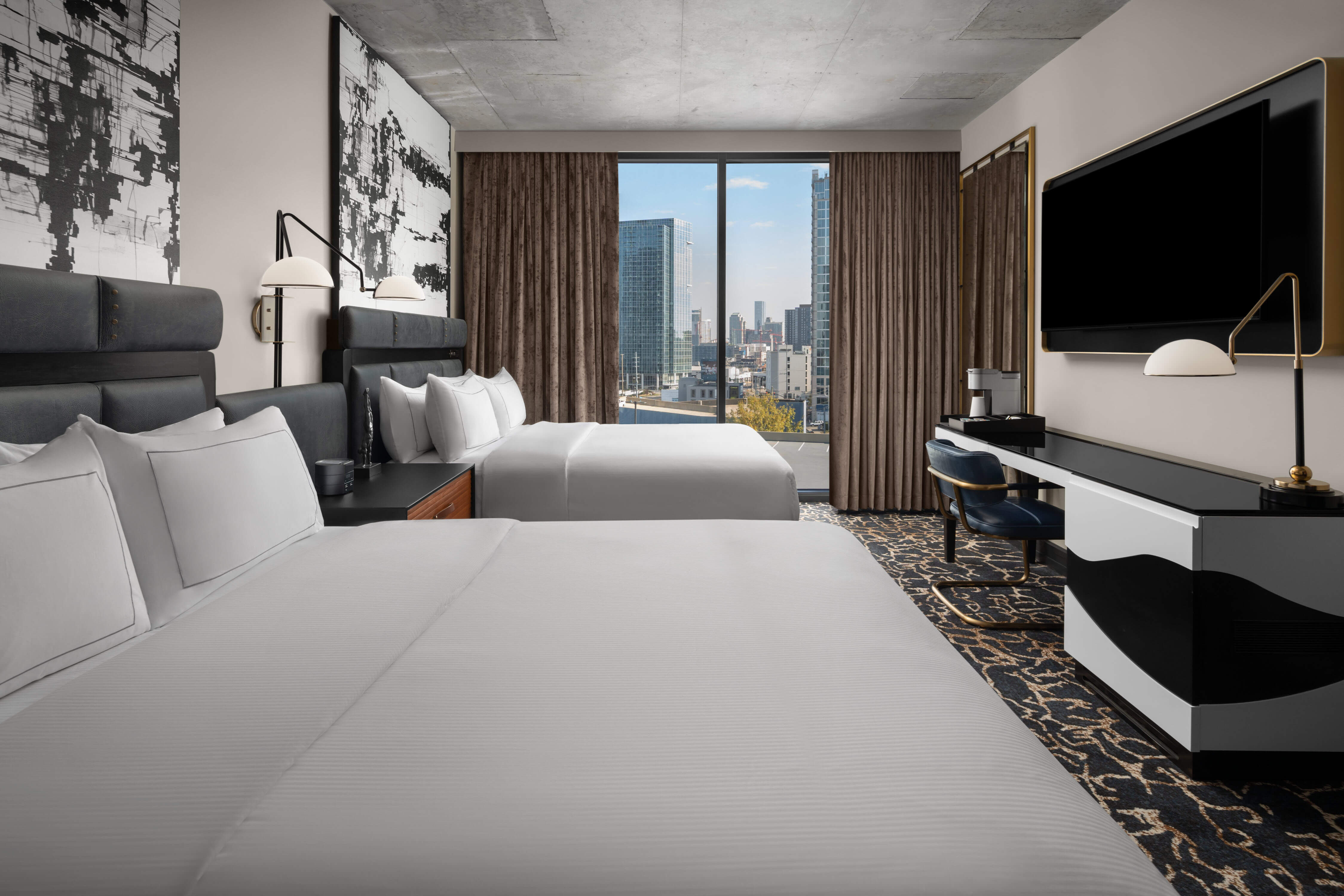 Interior room of Hotel Fraye Nashville Midtown showing two queen beds.