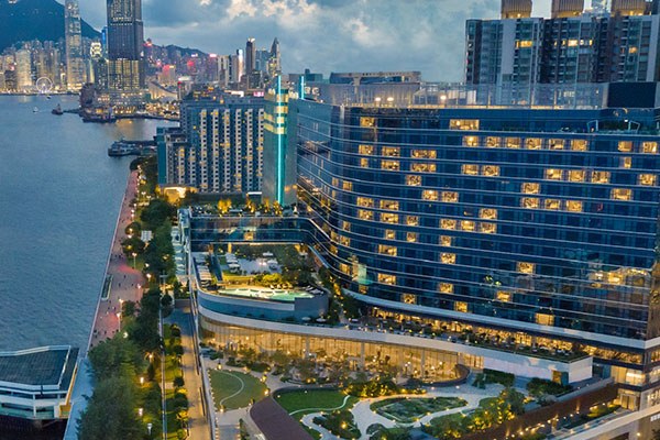 Exterior photo of the Kerry Hotel in the evening, looking at Hong Kong Island.